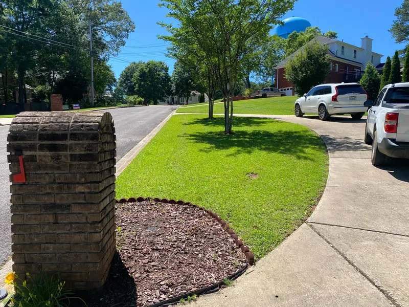Freshly mowed front lawn with crisp bed edges at a Trussville, Alabama home
